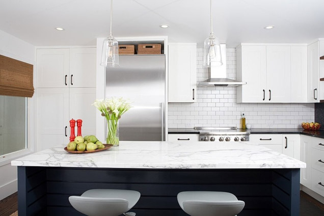 Bold Open White Kitchen Cabinets with Stainless Appliances and Navy Island