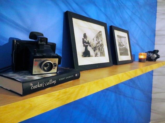 Close Up of Floating Shelf with Picture Frames