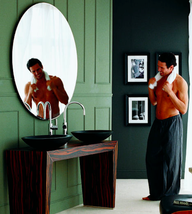 Fit Man Looking Into Mirror