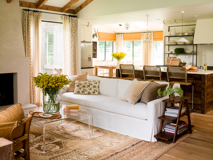 Living Room With White Couch Next To Kitchen Island