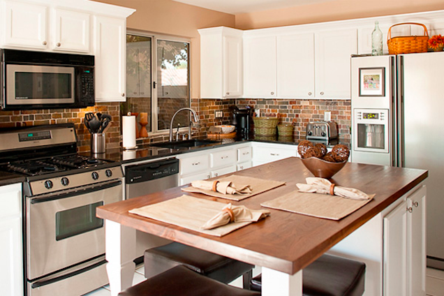 Transitional Kitchen of Natural Materials with Sleek Metal Accents and Appliances and White Kitchen Cabinets